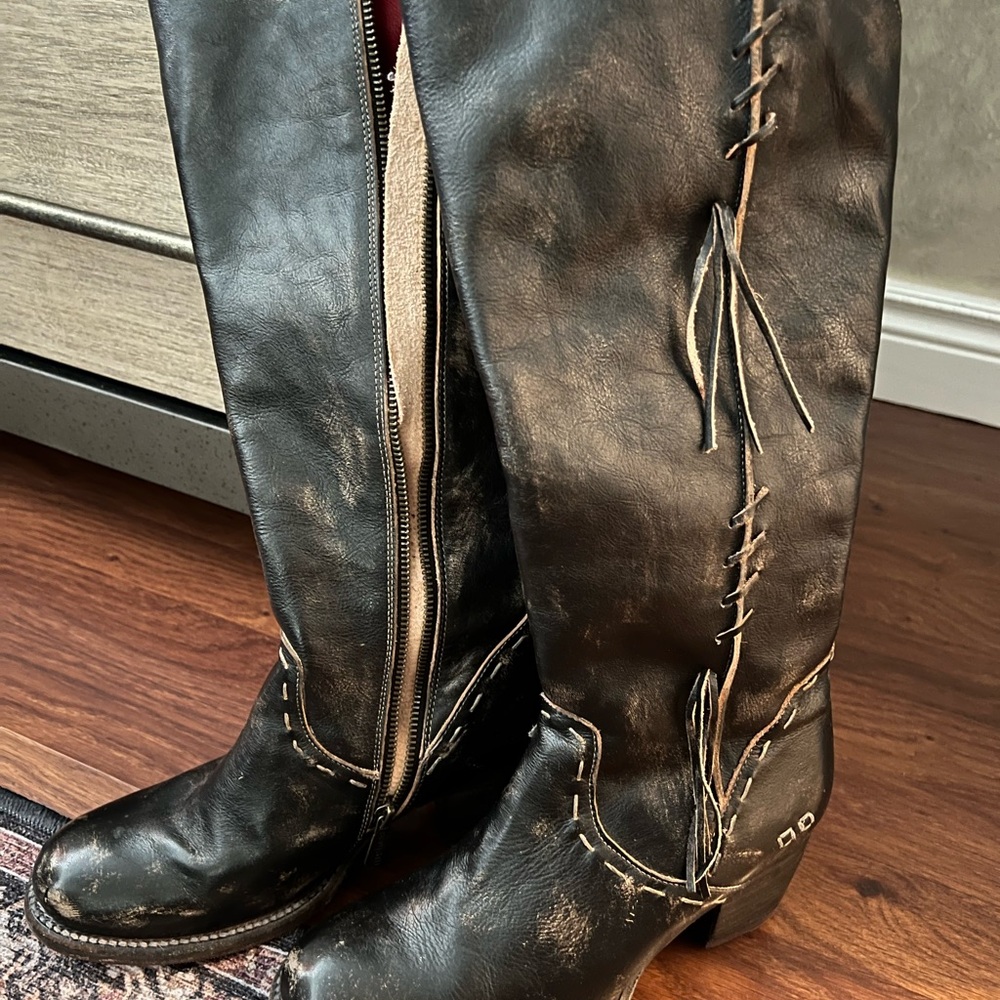 Rich dark brown knee high western stylee boots.